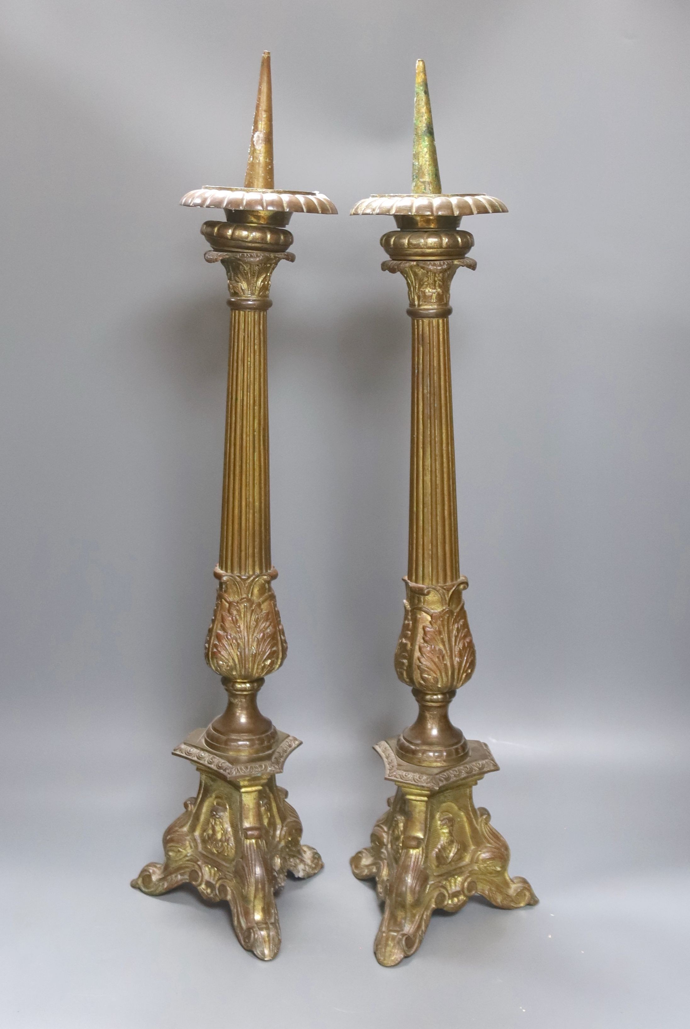 A pair of gilded brass pricket candlesticks 61cm